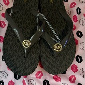 Michael Kors Black Flip Flops with Gold MK Medallions